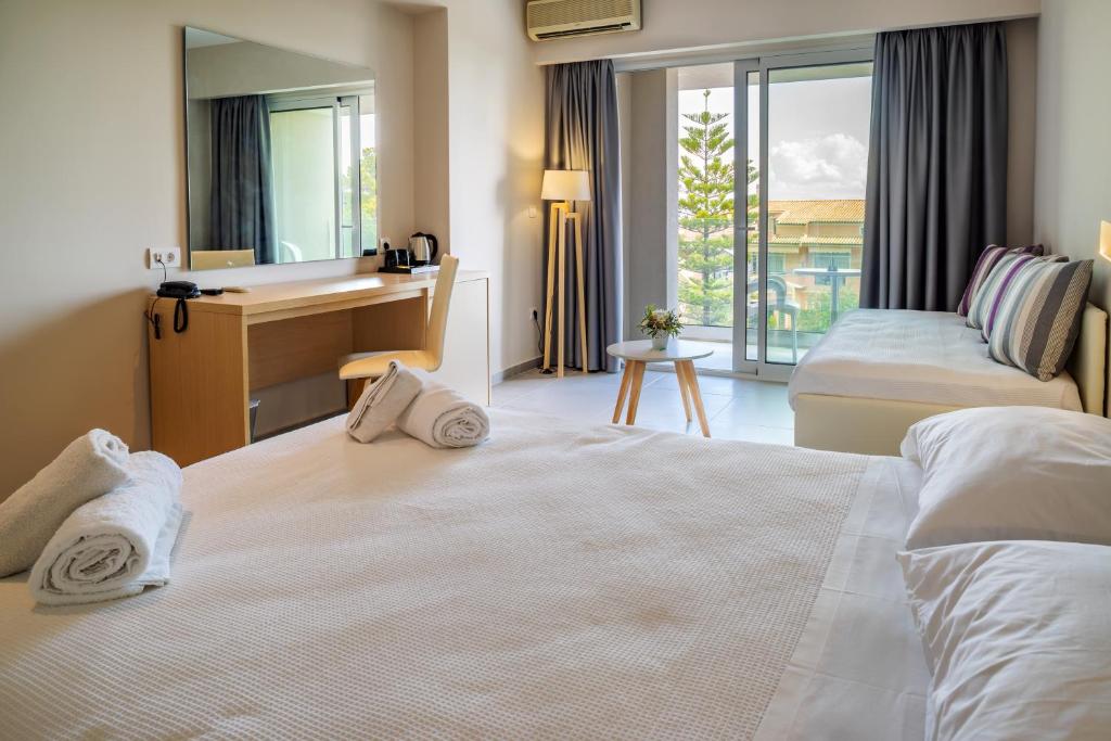 Postel nebo postele na pokoji v ubytování CNic Gemini Hotel