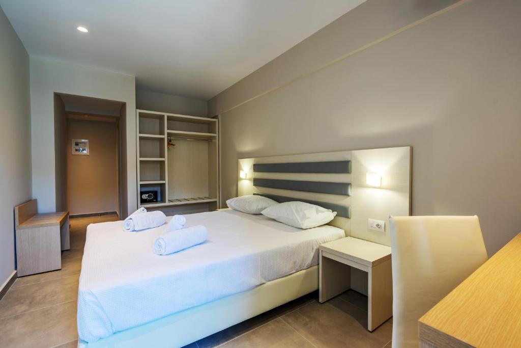 Postel nebo postele na pokoji v ubytování CNic Gemini Hotel