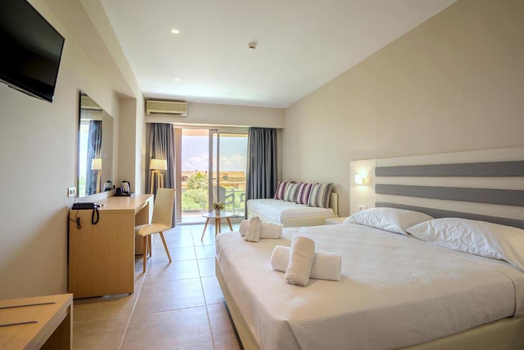 Postel nebo postele na pokoji v ubytování CNic Gemini Hotel