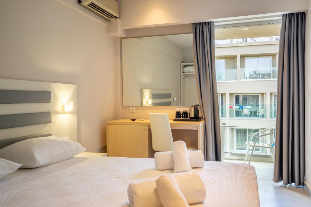 Postel nebo postele na pokoji v ubytování CNic Gemini Hotel