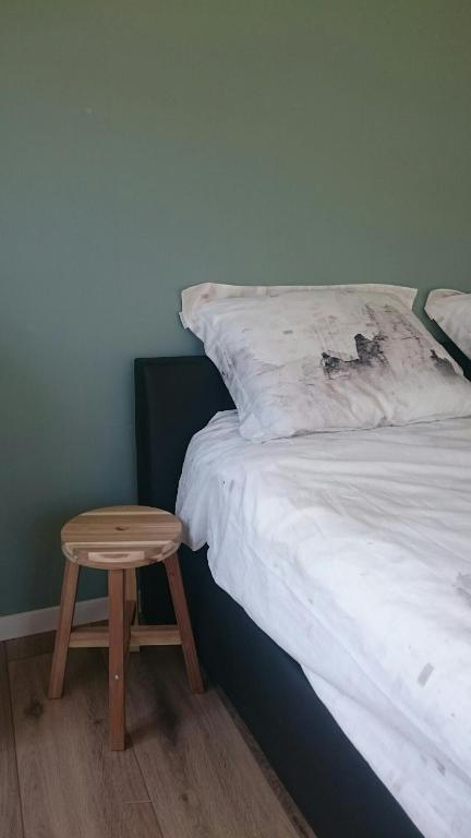 Postel nebo postele na pokoji v ubytování B&B De Reede