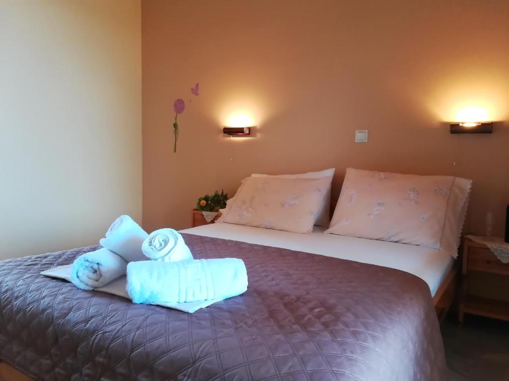 Postel nebo postele na pokoji v ubytování Artemis Pension