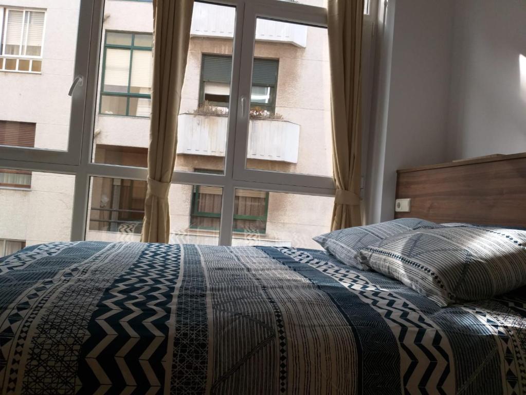 Posteľ alebo postele v izbe v ubytovaní Apartamento en Ribeira(centro) 2* planta