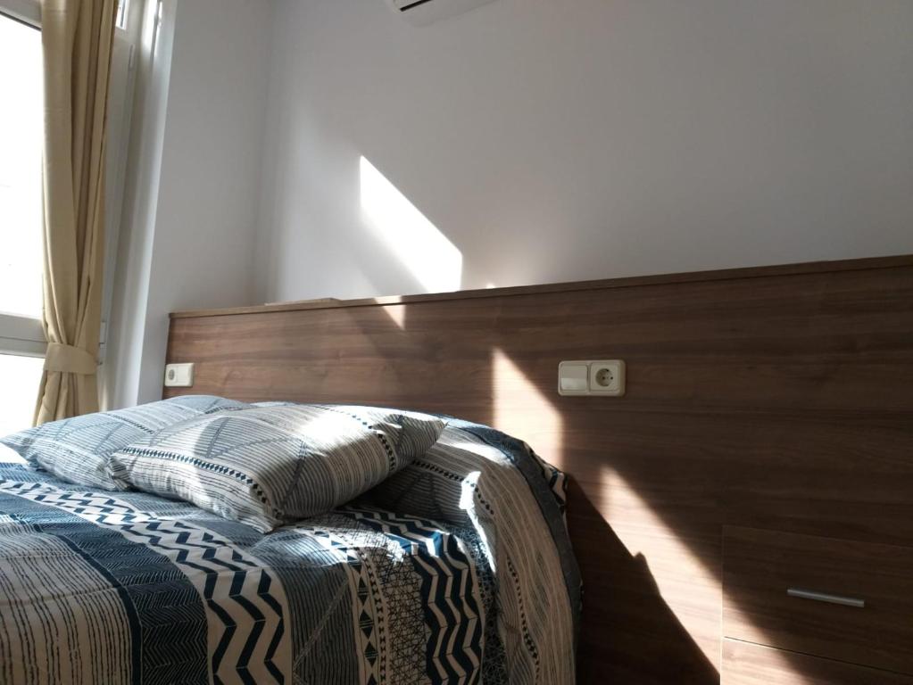 Posteľ alebo postele v izbe v ubytovaní Apartamento en Ribeira(centro) 2* planta