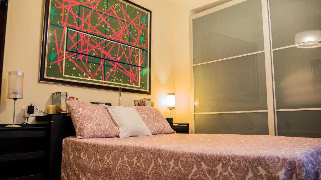 Posteľ alebo postele v izbe v ubytovaní Apartamento El Salón