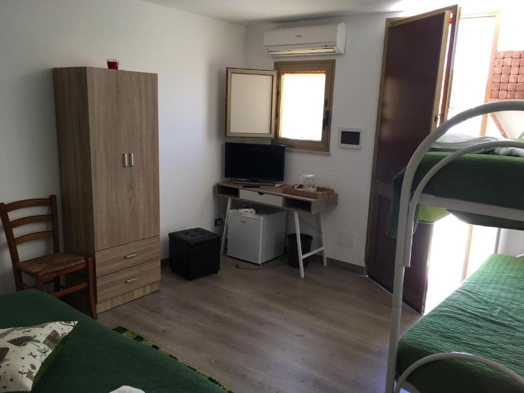 Postel nebo postele na pokoji v ubytování Camere Con Terrazzino