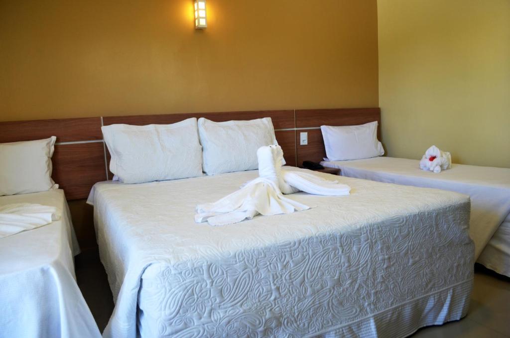 Postel nebo postele na pokoji v ubytování Pontal Praia Hotel
