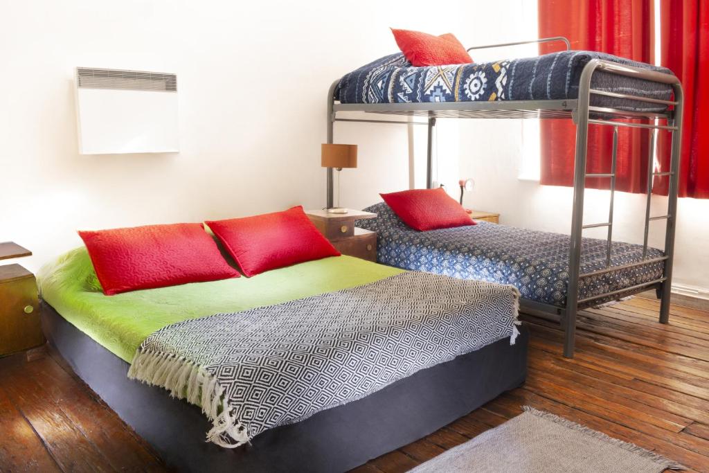 Postel nebo postele na pokoji v ubytování Casa Volante Hostal