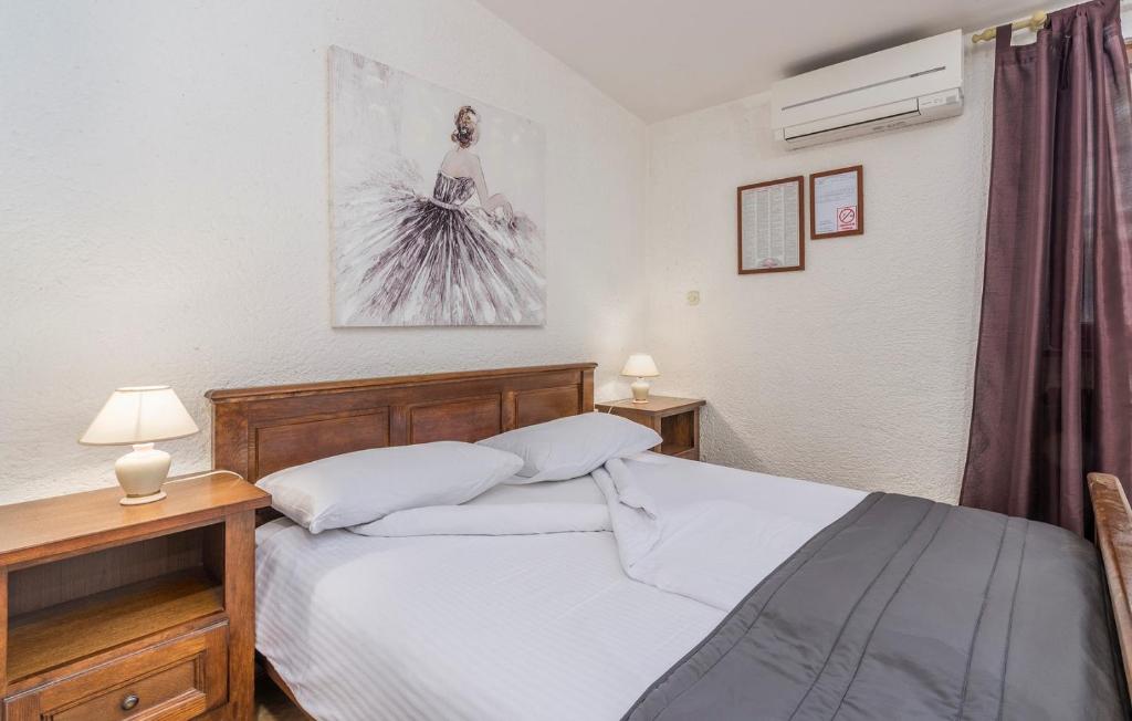 Postel nebo postele na pokoji v ubytování Apartments Rakovac