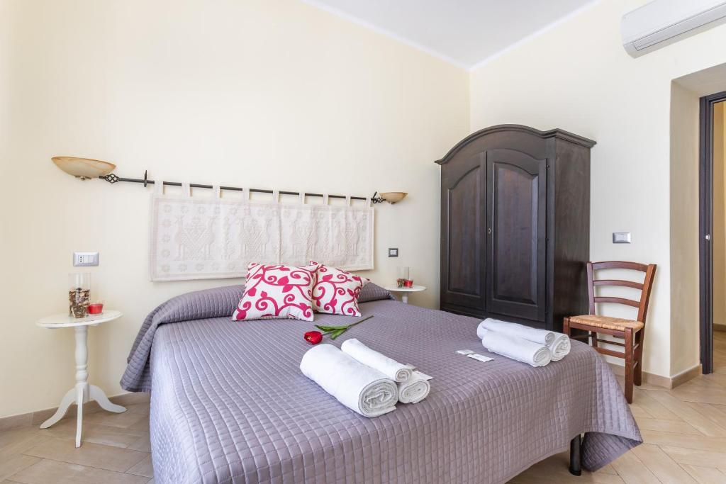 Postel nebo postele na pokoji v ubytování B&B Villamarì