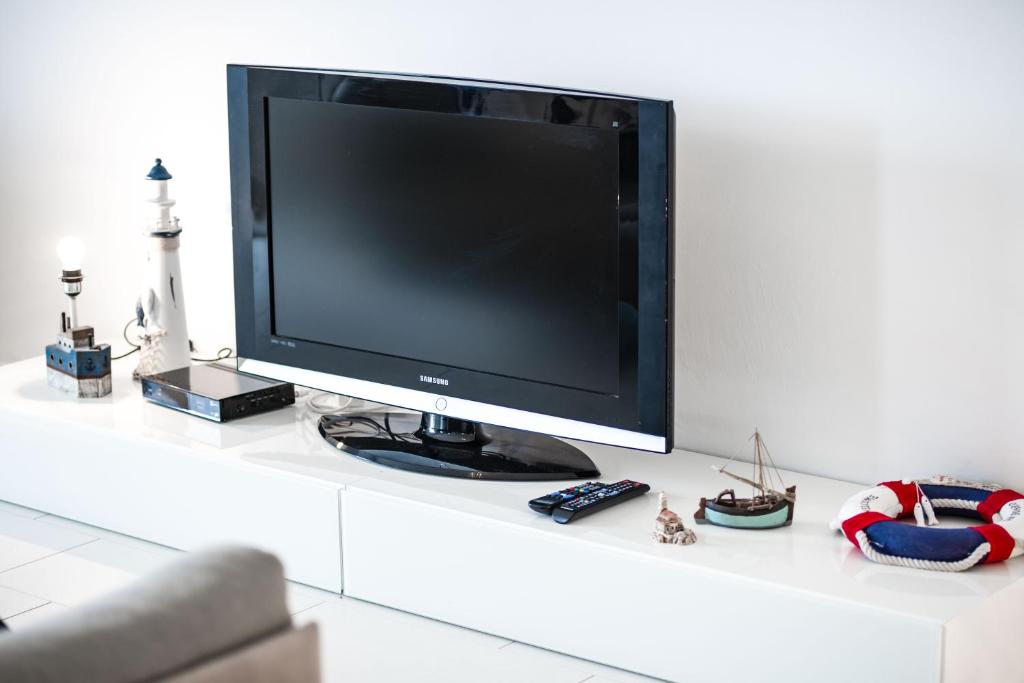 Televízia a/alebo spoločenská miestnosť v ubytovaní Villa Mario - Rogoznica