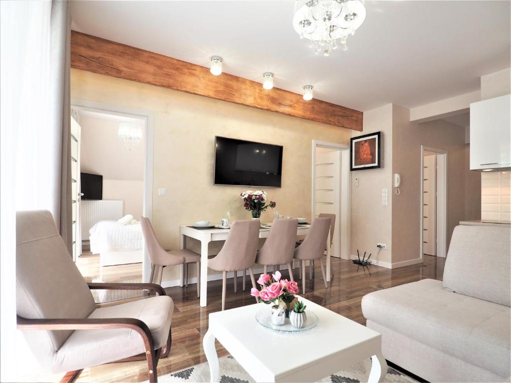 Televízia a/alebo spoločenská miestnosť v ubytovaní VIP Apartamenty Cristal