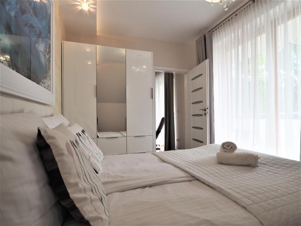 Posteľ alebo postele v izbe v ubytovaní VIP Apartamenty Cristal