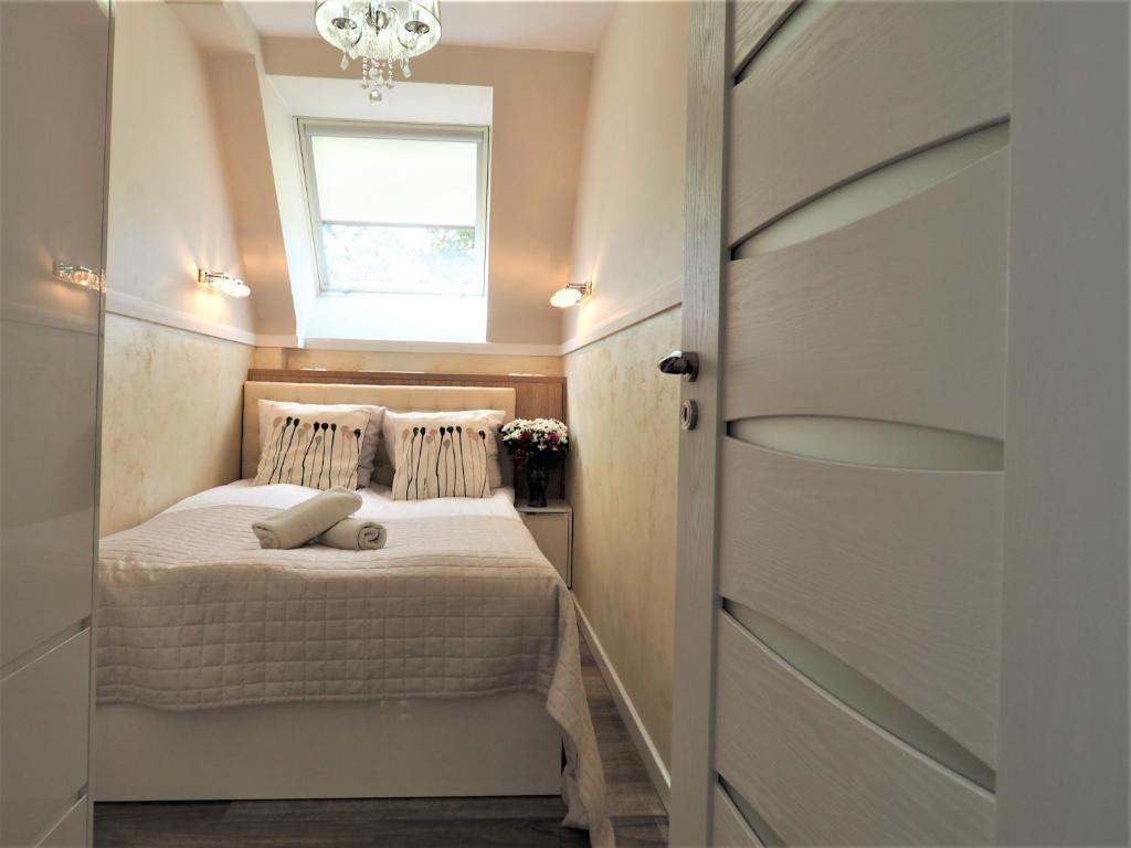 Posteľ alebo postele v izbe v ubytovaní VIP Apartamenty Cristal