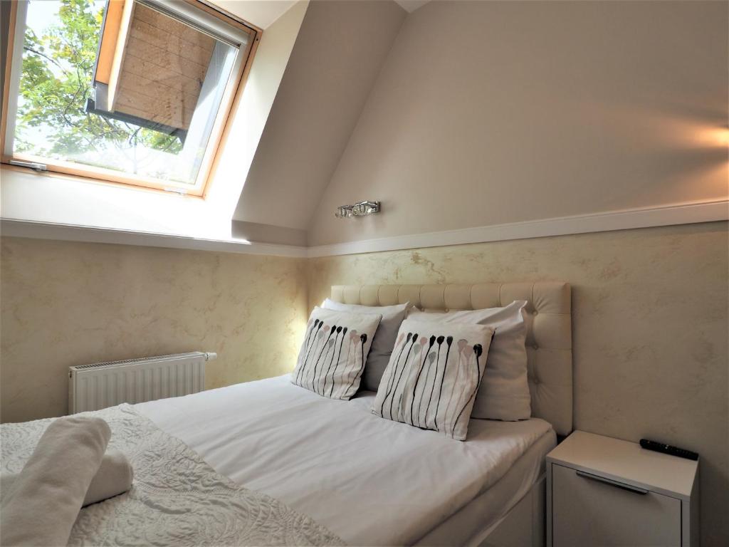 Posteľ alebo postele v izbe v ubytovaní VIP Apartamenty Cristal