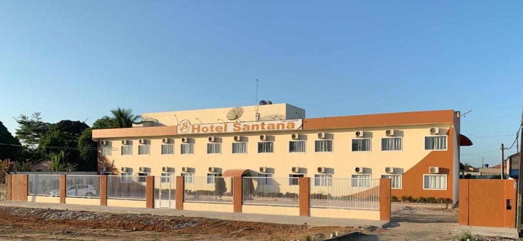 a building with a fence in front of it at Hotel Santana - Posto da Mata BA in Pasto da Mata