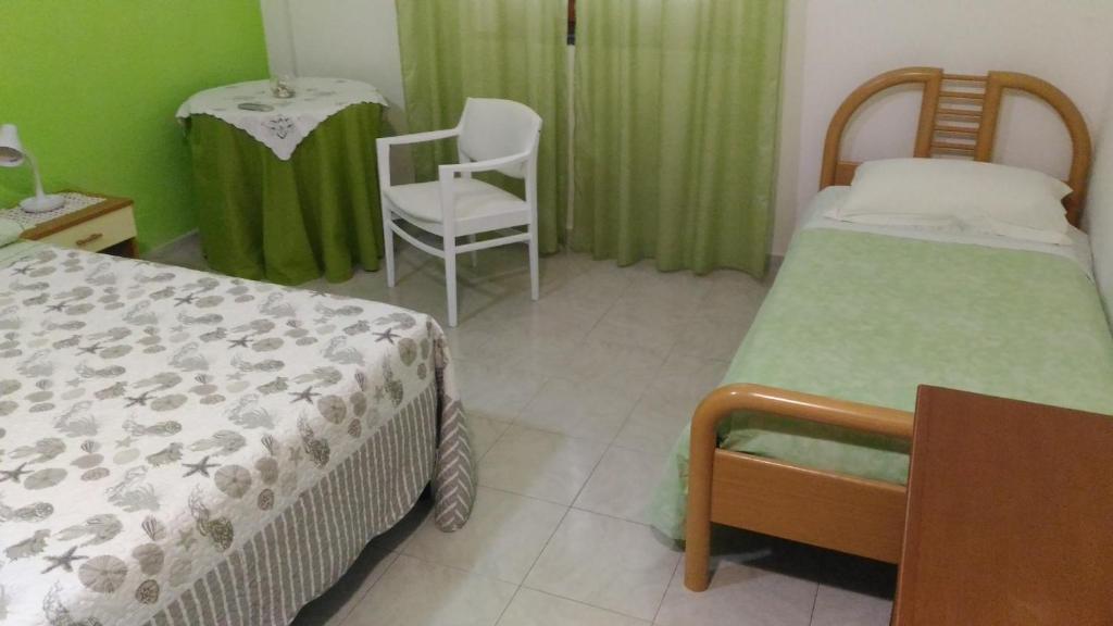 Postel nebo postele na pokoji v ubytování B&b Margherita