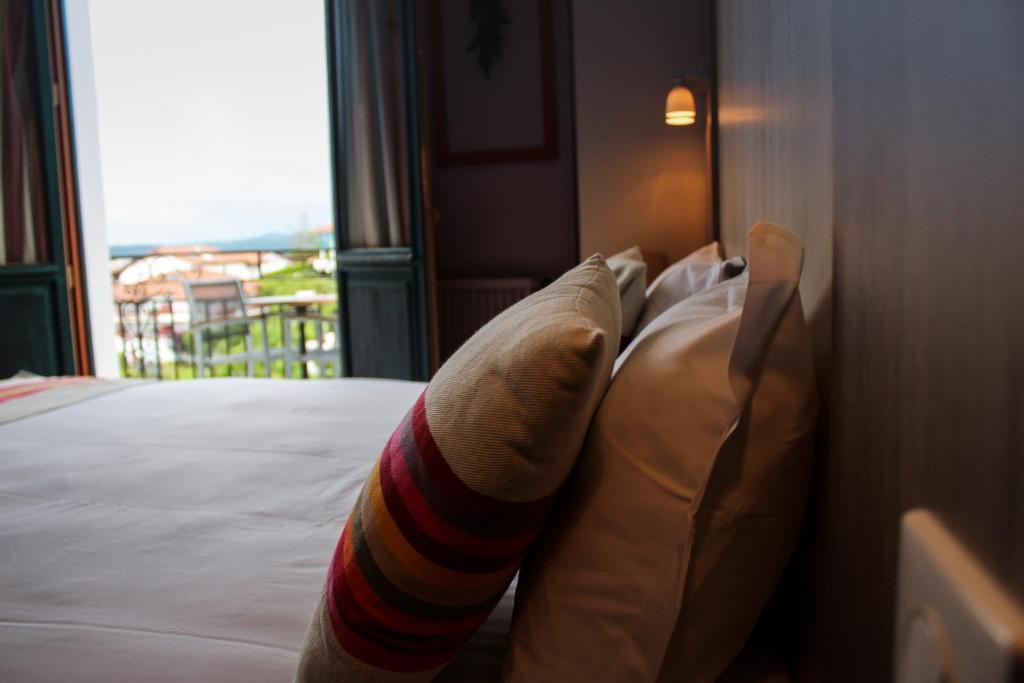 Postel nebo postele na pokoji v ubytování Hotel Agur Deneri