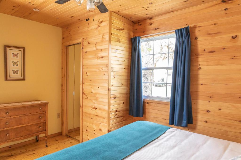 Voodi või voodid majutusasutuse Fairways Cottages toas