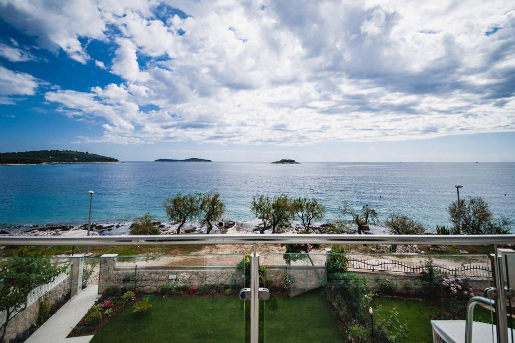 a view of the ocean from a balcony at Villa Mario in Rogoznica