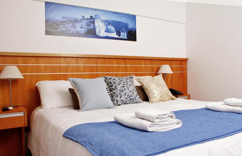 Postel nebo postele na pokoji v ubytování Catamarca Suites Land