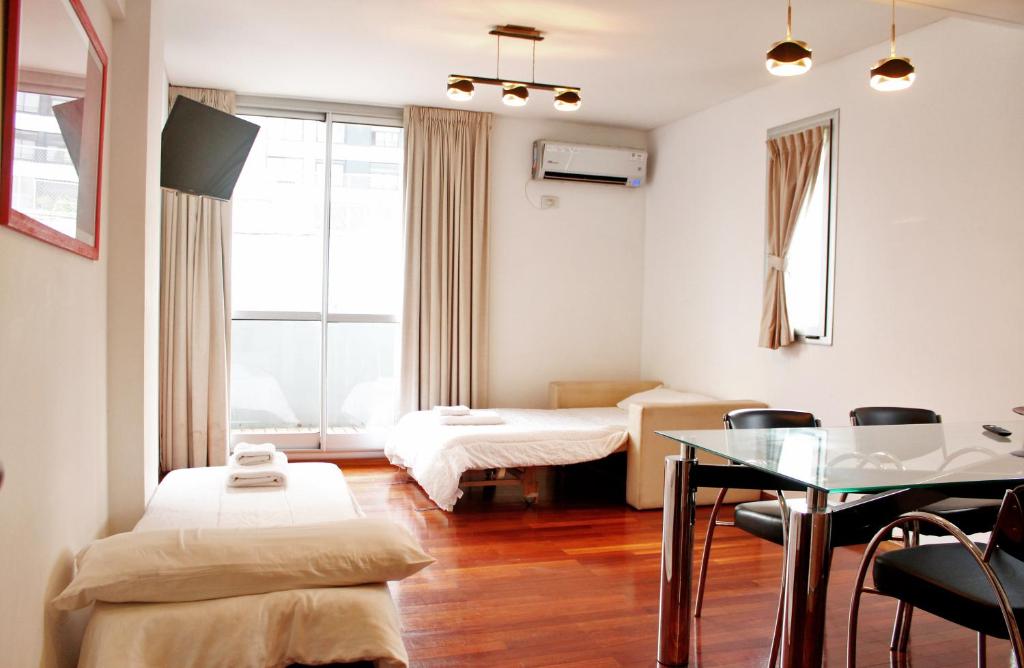 Postel nebo postele na pokoji v ubytování Catamarca Suites Land