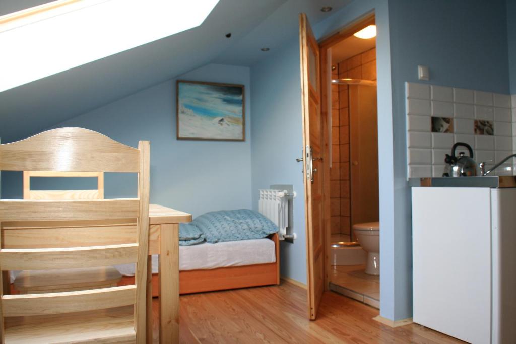 Ένα ή περισσότερα κρεβάτια σε δωμάτιο στο Apartament Rodzinny