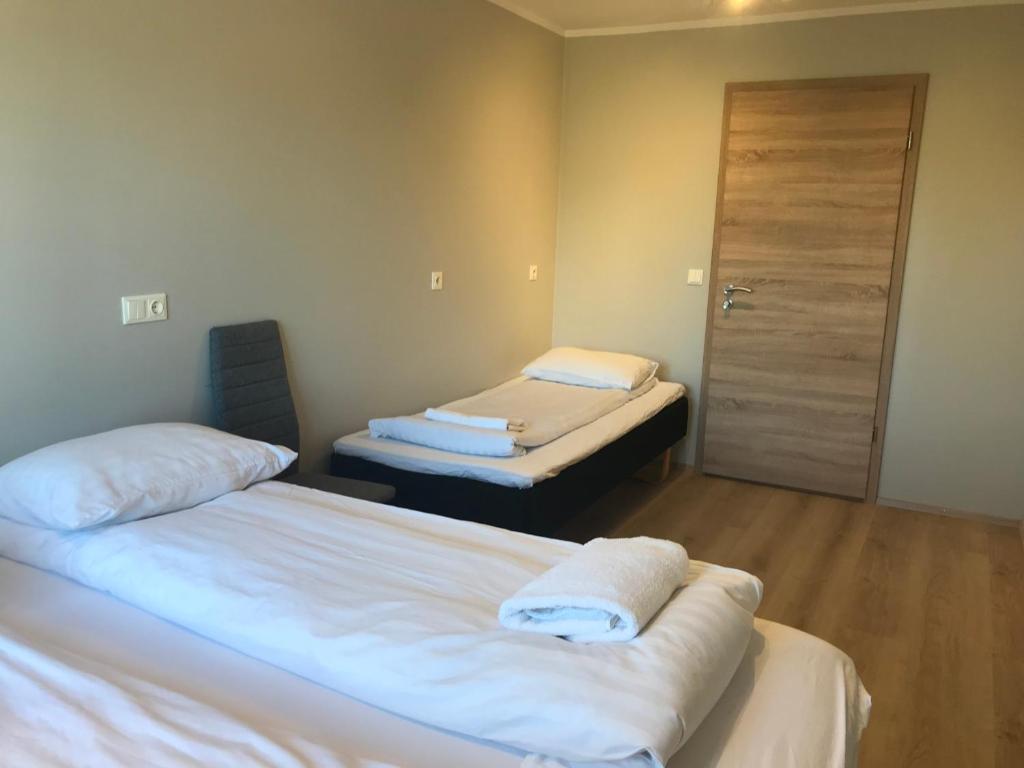 Postel nebo postele na pokoji v ubytování Guesthouse Skógafoss