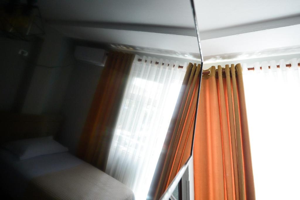 Postel nebo postele na pokoji v ubytování Hotel Niku
