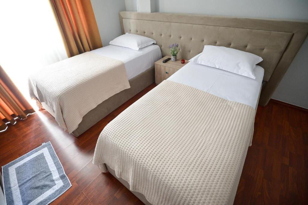 Postel nebo postele na pokoji v ubytování Hotel Niku