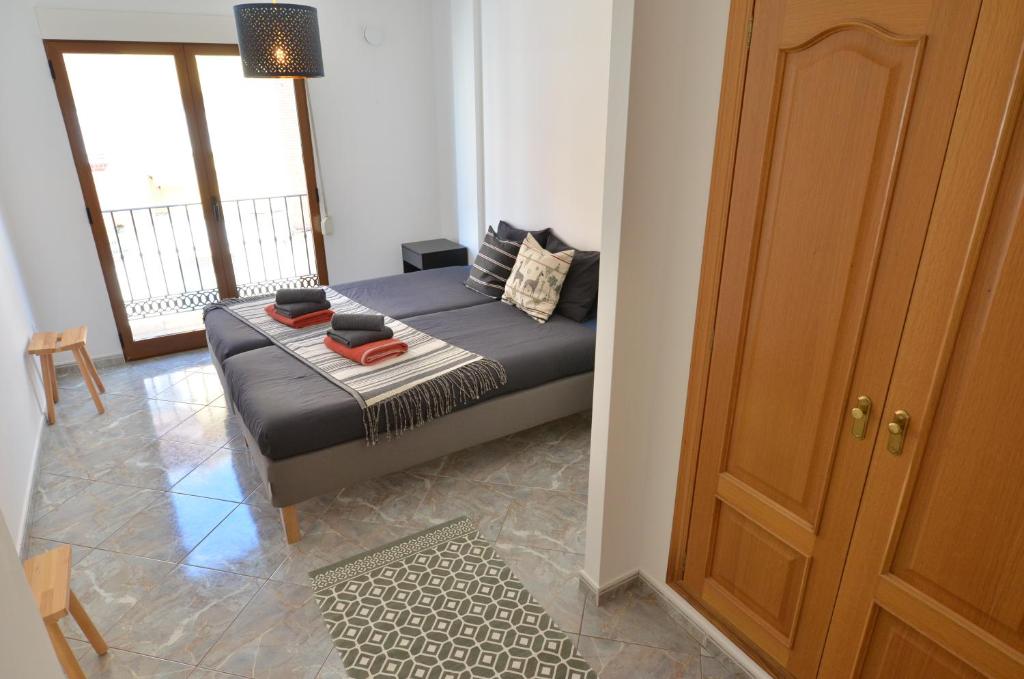 Postel nebo postele na pokoji v ubytování The green townhouse in Denia centre by NRAS