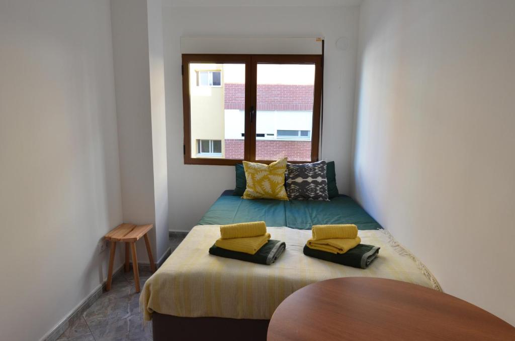 Postel nebo postele na pokoji v ubytování The green townhouse in Denia centre by NRAS