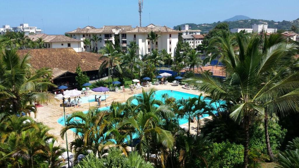 an aerial view of a resort with a swimming pool at CONDOMINIO WEMBLEY TENIS in Ubatuba