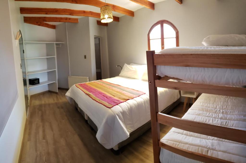 Postel nebo postele na pokoji v ubytování Hotel Jardin Atacama