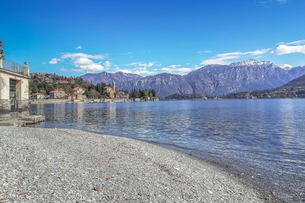 a view of a body of water with mountains at Apartment Best - Tremezzina in Tremezzo