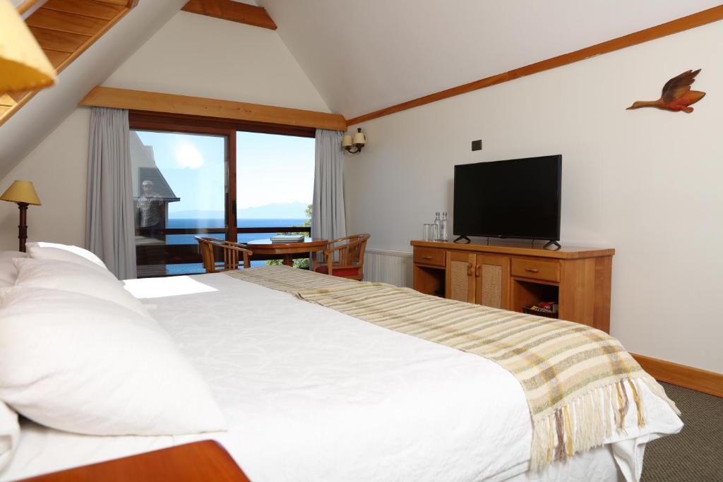 Cama o camas de una habitación en Hotel Puelche
