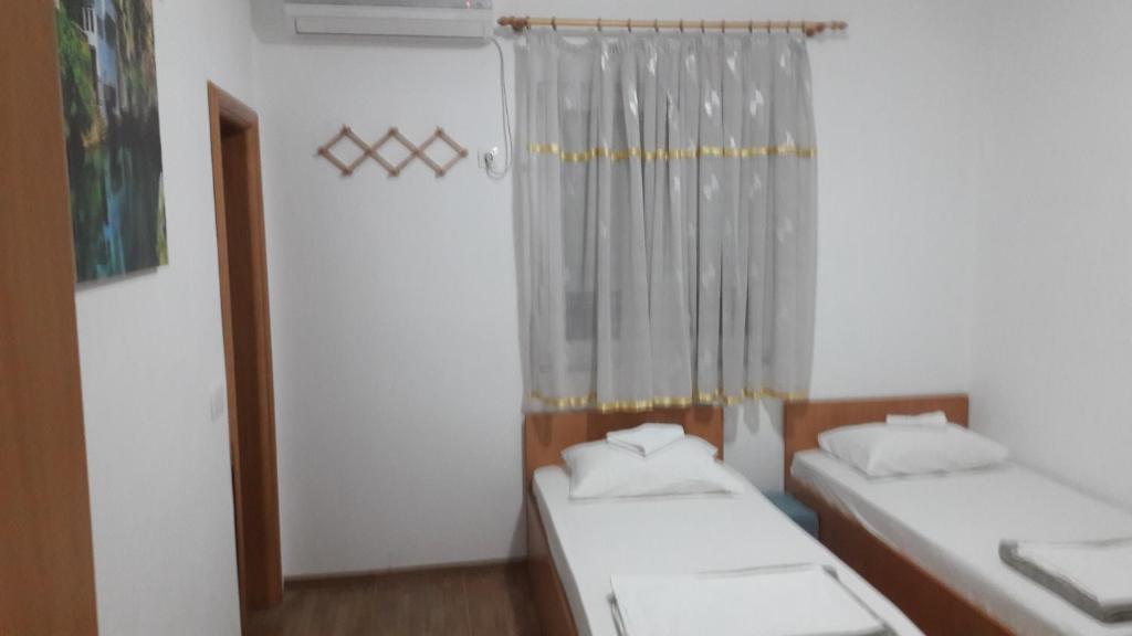 Postel nebo postele na pokoji v ubytování Hostel Hercegovina