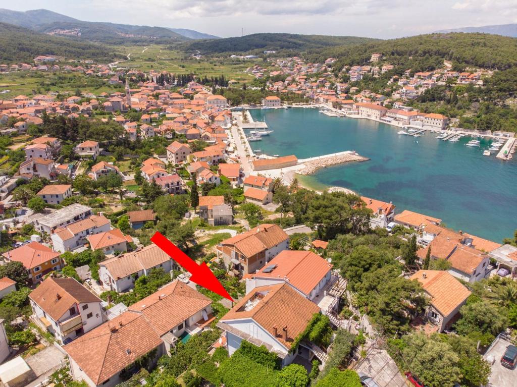 an aerial view of a small town next to a body of water at Apartments Jelka in Jelsa