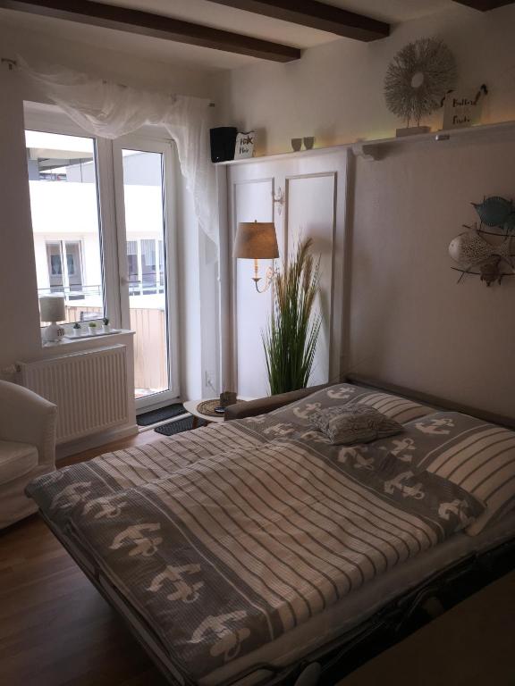 Postel nebo postele na pokoji v ubytování Haus Solymar App. Meerblick