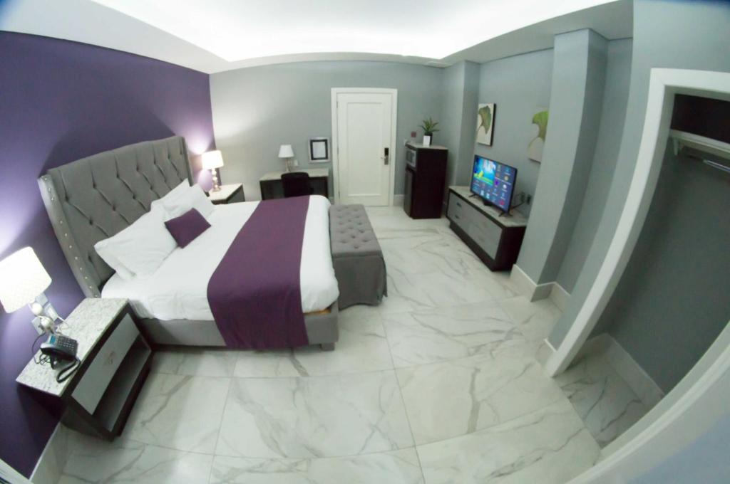 Postel nebo postele na pokoji v ubytování Gran Hotel Cantera La plaza
