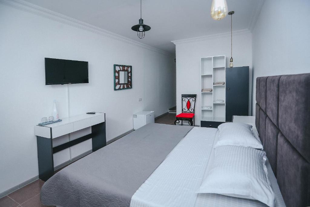 Postel nebo postele na pokoji v ubytování Hotel Tamar Mepe