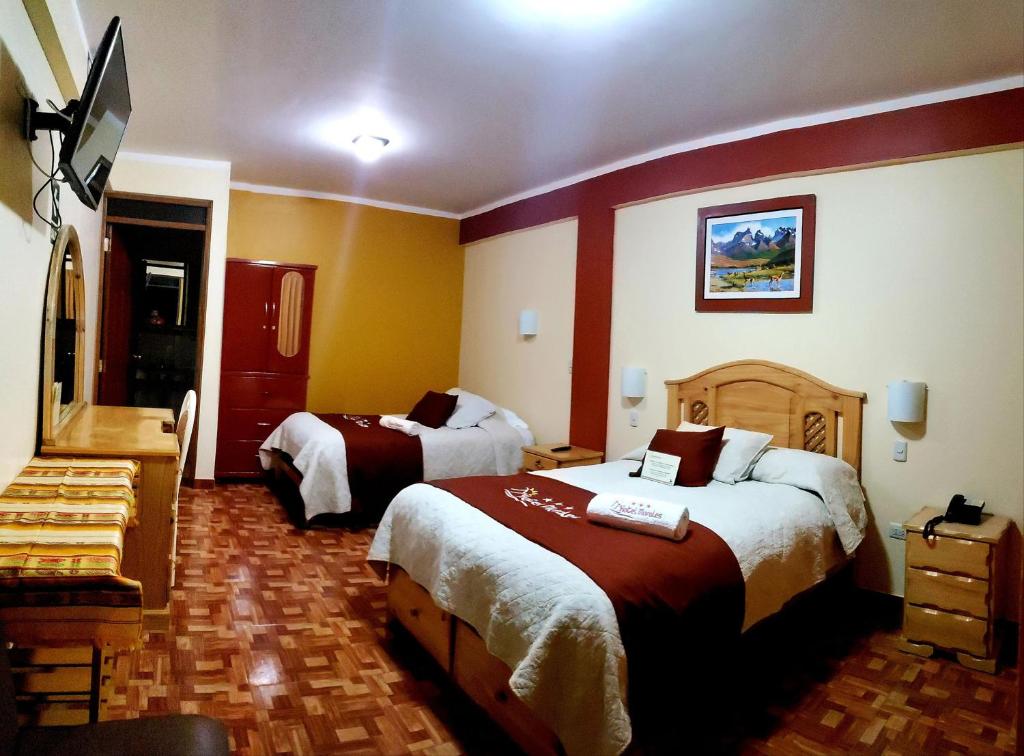 Postel nebo postele na pokoji v ubytování Morales Guest House