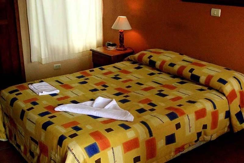 Postel nebo postele na pokoji v ubytování Hotel Guadalupe