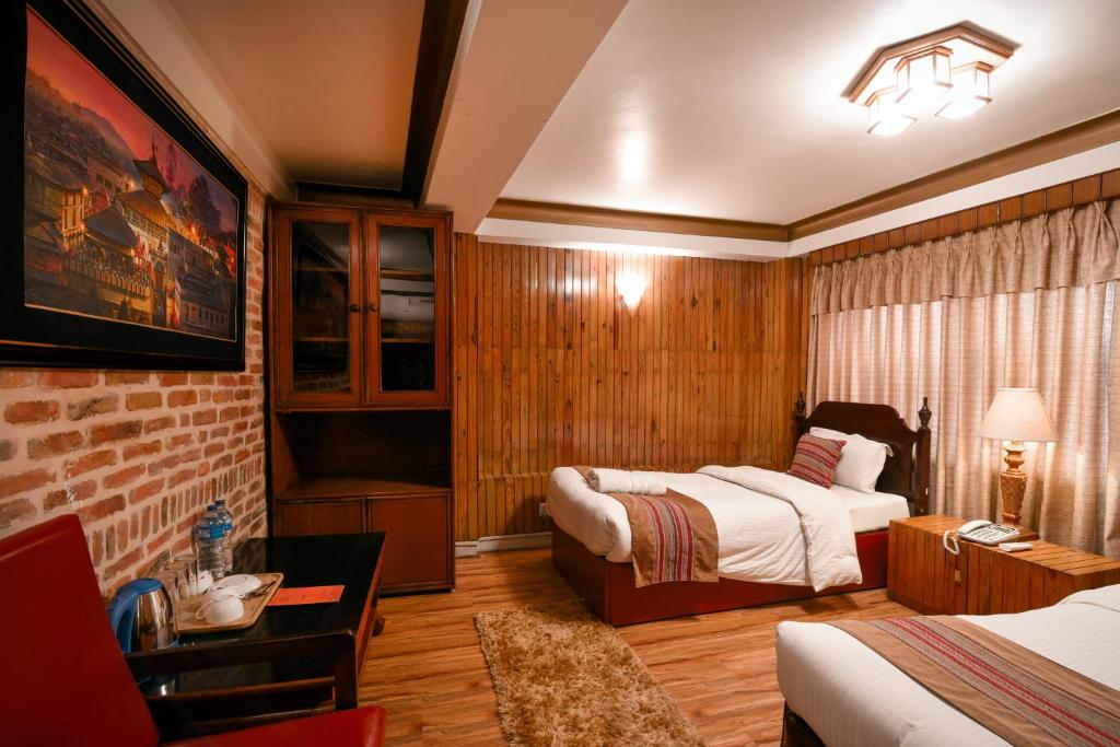 Postel nebo postele na pokoji v ubytování Nepal Pavilion Inn