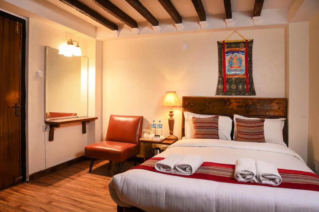 Postel nebo postele na pokoji v ubytování Nepal Pavilion Inn