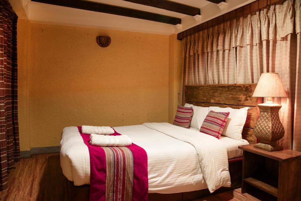 Postel nebo postele na pokoji v ubytování Nepal Pavilion Inn
