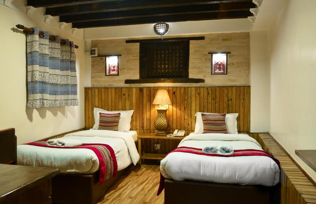 Postel nebo postele na pokoji v ubytování Nepal Pavilion Inn