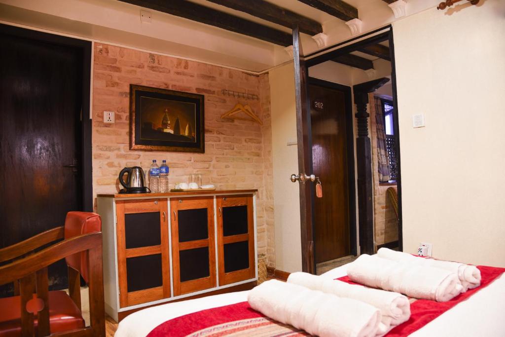 Postel nebo postele na pokoji v ubytování Nepal Pavilion Inn