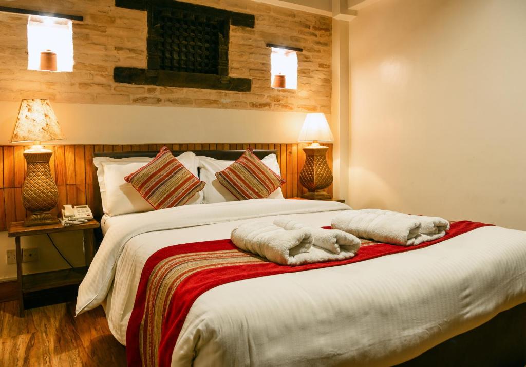 Postel nebo postele na pokoji v ubytování Nepal Pavilion Inn