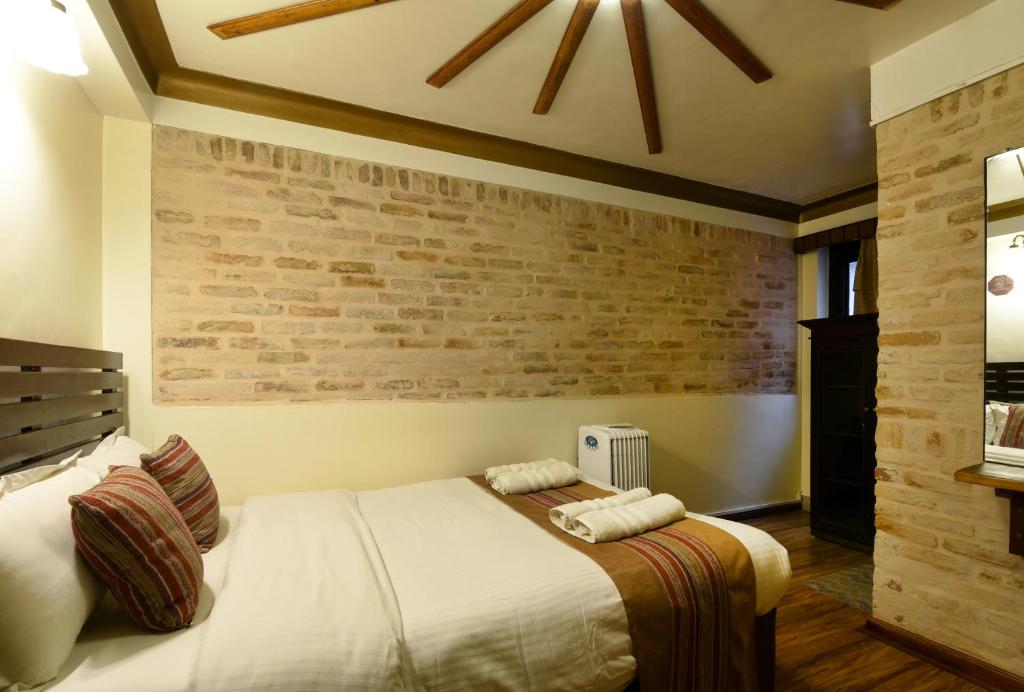 Postel nebo postele na pokoji v ubytování Nepal Pavilion Inn